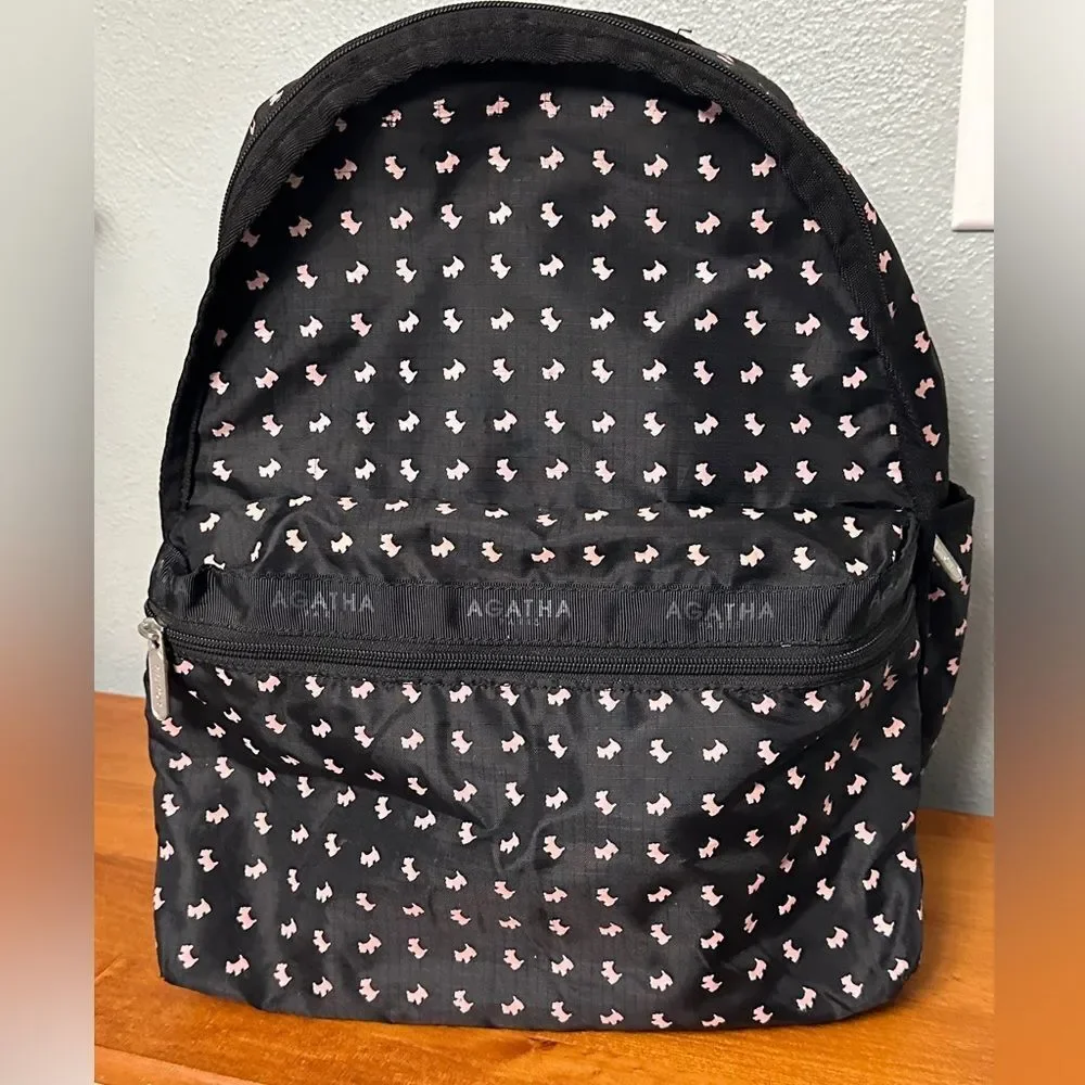 Agatha Paris Black Backpack With Pink Scottie Dog Pattern all over.